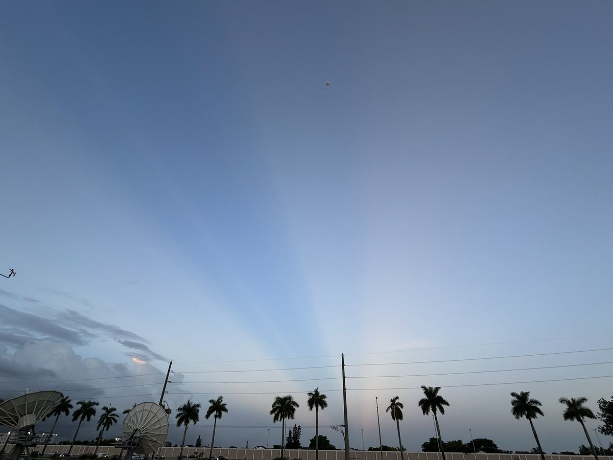 NWSMiami's tweet photo. 8/30: Wow π€© Check out these stunning Crepuscular Rays! This was due to a large developing shower blocking the golden hour sunlight.
#BonusCredit: Can you spot the morning weather balloon and moon? ππ
Another active day is expected across our area! Pack your umbrella! βοΈ https://t.co/ZRxdjBN68H