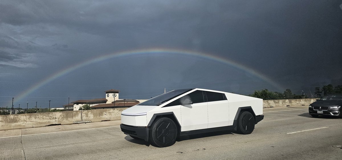 ShaneParks13's tweet photo. Got photo bombed by @elonmusk and his @cybertruck yesterday, whole taking a picture of a rainbow in Houston yesterday! https://t.co/FmGQtBSxnr