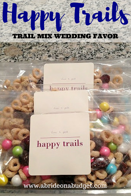 I'm a big fan of handing out some form of snack at the end of the night.

We did a full candy buffet.

If you want to do something a little simpler, our Happy Trails wedding favor is punny and perfect.

Find out how to make it here: abrideonabudget.com/2014/05/weddin…

#NationalTrailMixDay
