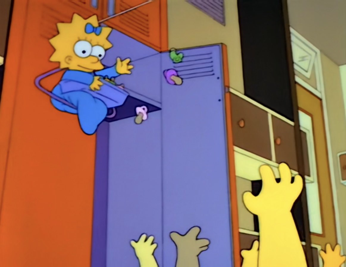 Maggie handing pacifiers to children