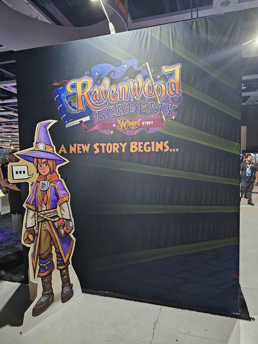 A view of the #RavenwoodAcademy portion of <a href="/KingsIsle/">KingsIsle</a>'s booth at PAX West shared by Joel "Decius" White (<a href="/jetsers/">Joel - Decius</a>) on the official <a href="/Wizard101/">Wizard101</a> Discord!

It features the as-of-yet-unnamed protagonist against library shelves and a new tagline - "a new story begins..."