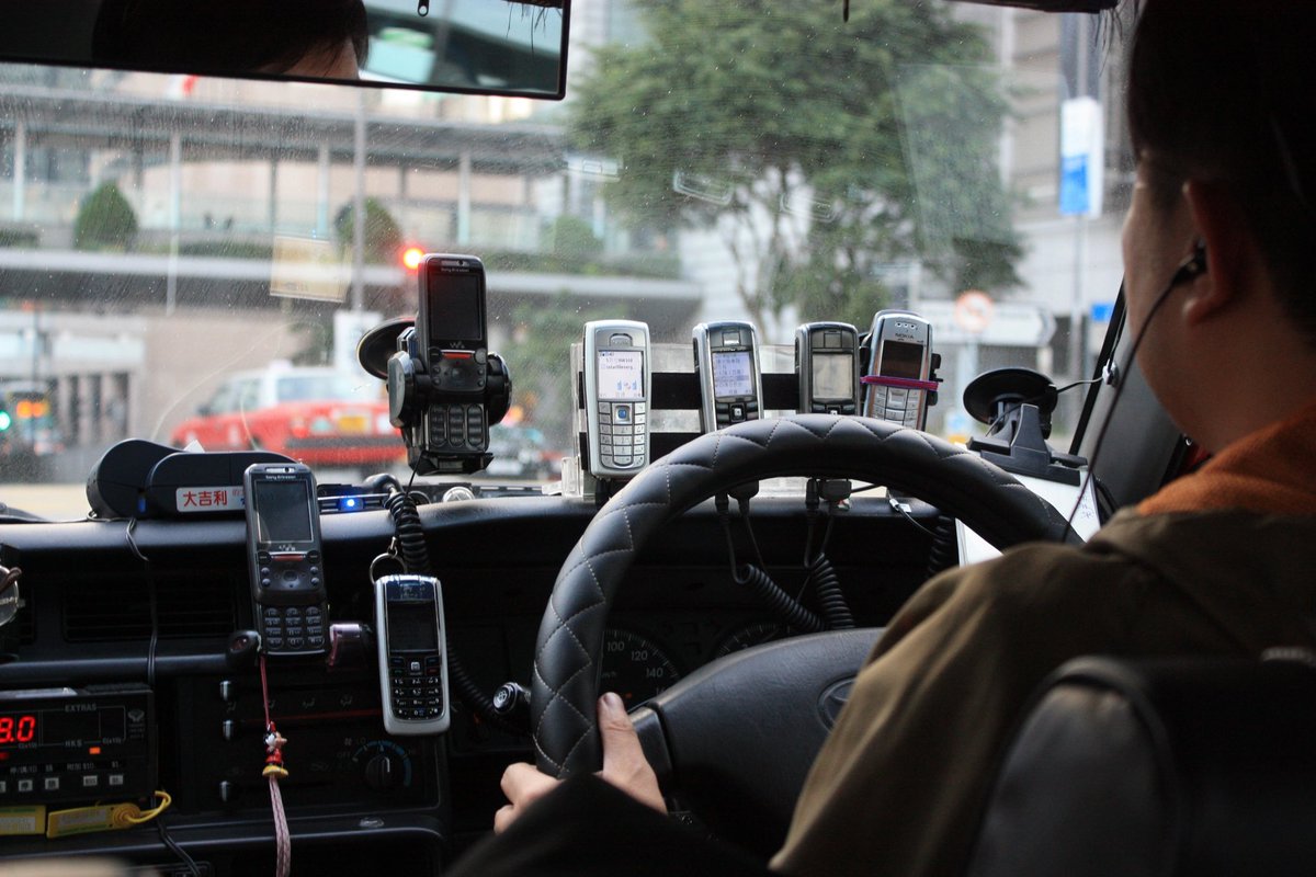 stylenerd's tweet photo. @antriksh_s My HK taxi driver back in 2011. He also constantly switched between 3-5 calls using different headsets. I think he was running some kind of betting studio https://t.co/U3hCbqFcAc