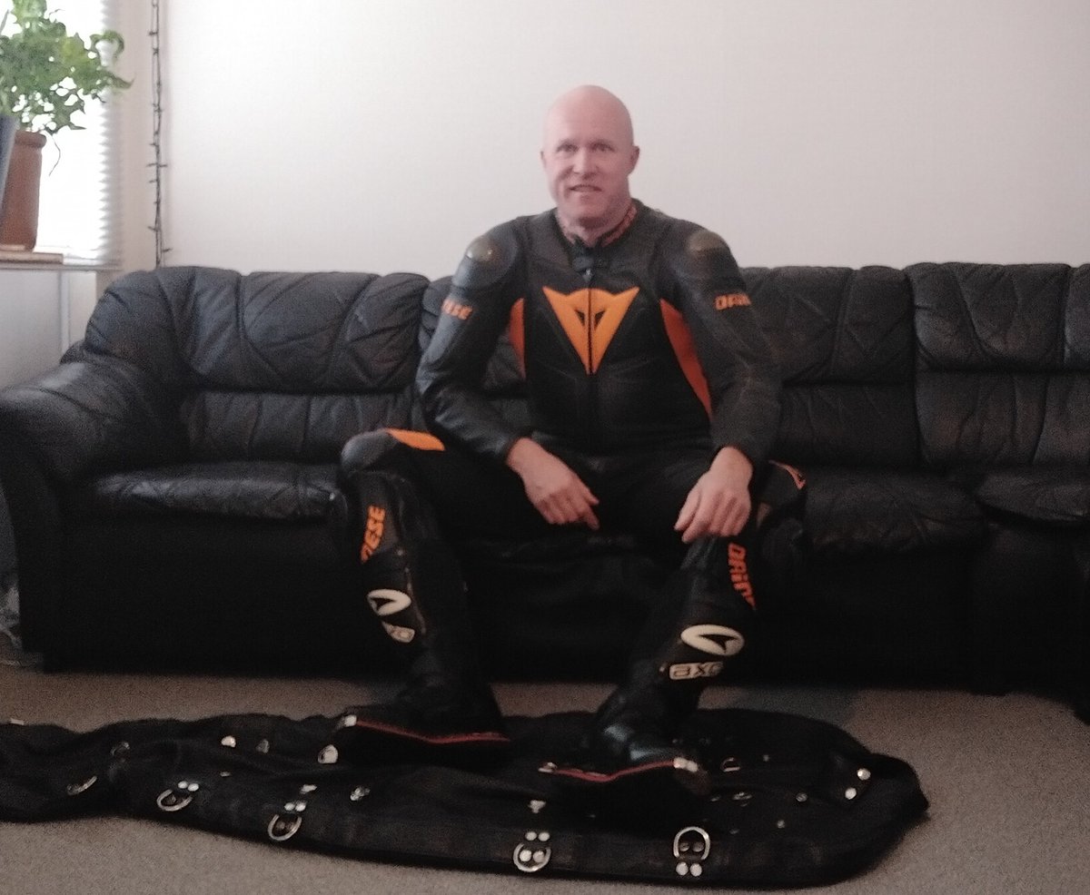 Master waiting for fetish object to enter leather sleepsack