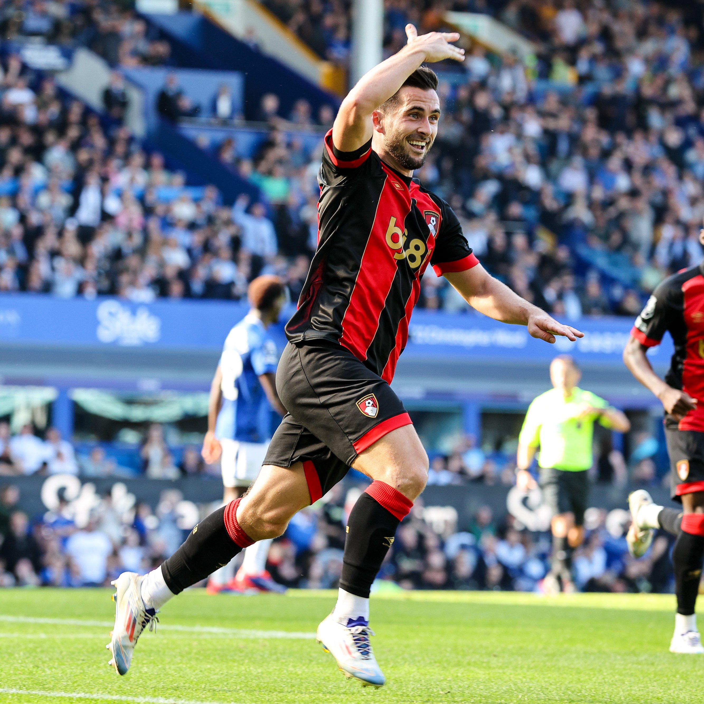 Lewis Cook runs away to celebrate his goal against Everton.