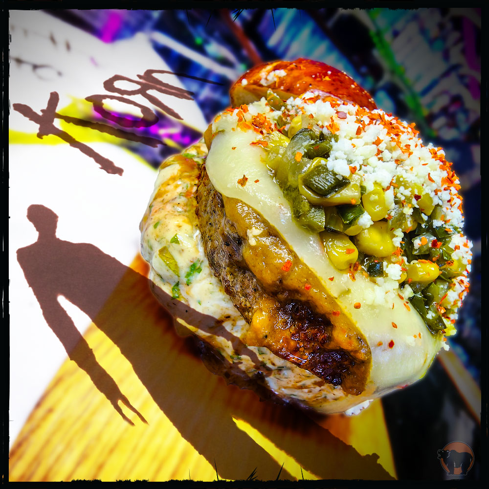 For the September Burger of the Month, we offer...
@korn 
Kuma’s Angus Beef Patty (or choice of protein), Cilantro Lime Aioli, Korn Here To Slay Hot Sauce, Habanero Jack Cheese, Roasted Poblano Corn Relish, Cotija Cheese, Tajin

Available at all Chicagoland Kuma's!