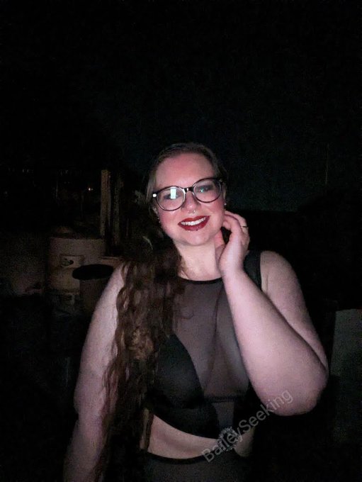 A beautiful black gown, black and red corset heels, and a scrapyard. Gorgeous.  Full set available on