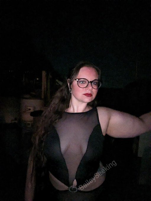 A beautiful black gown, black and red corset heels, and a scrapyard. Gorgeous.  Full set available on