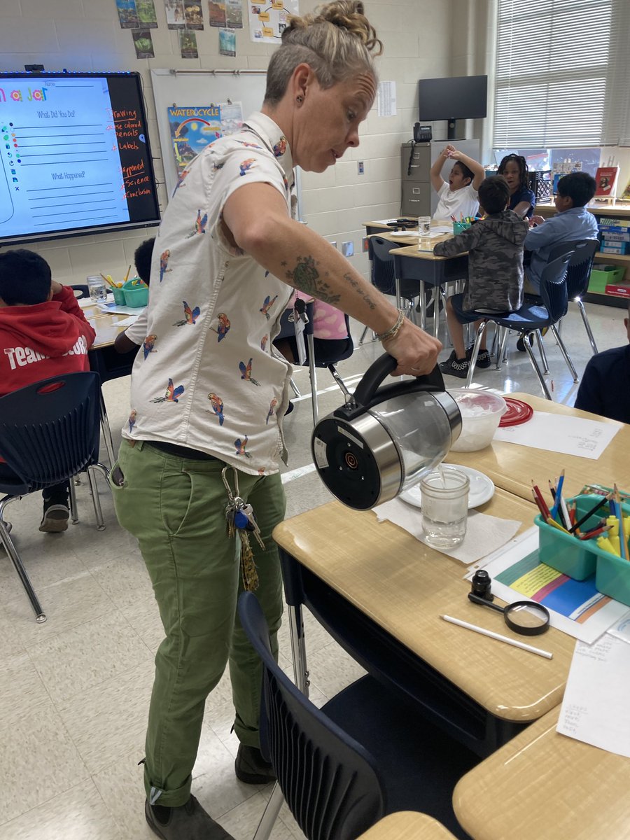 Teacher Adrian prepares for the science lab on cloud formation