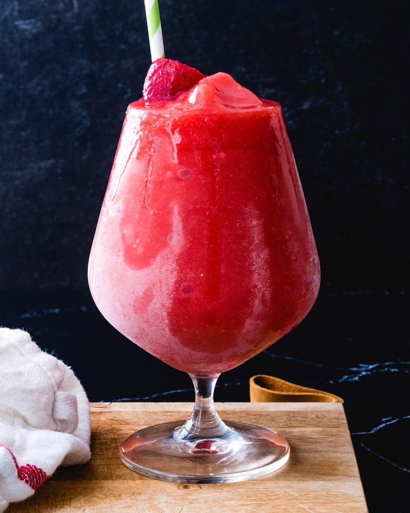 ⟶
He cuts a strawberry to get a slice to lay it gently on top before sliding the drink over to Dani.

⠀⠀   〝 A Strawberry Daiquiri for my fair lady, on the house. 〞