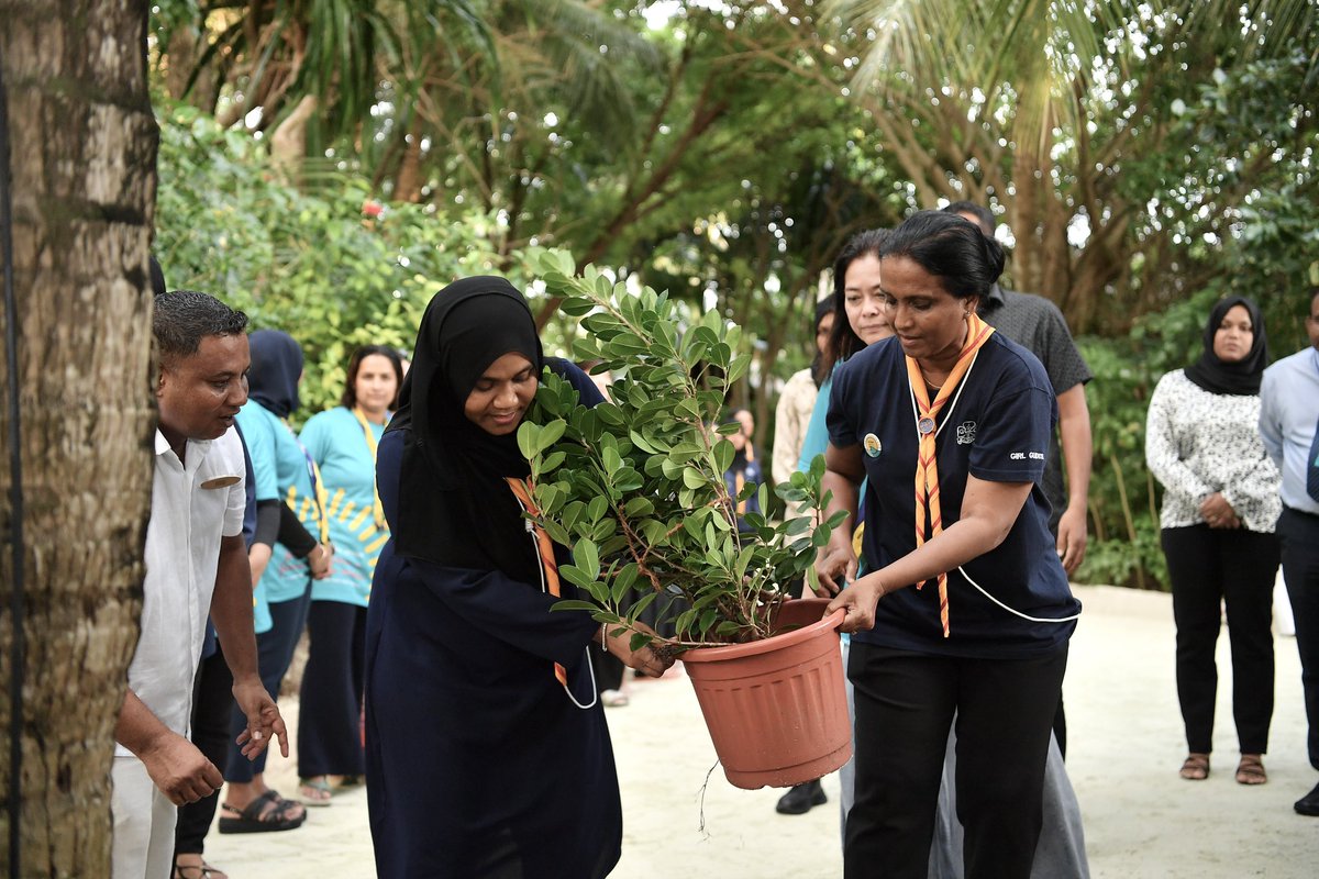 presidencymv's tweet photo. Chief Guide, First Lady Madam Sajidha Mohamed, participates in the tree planting event held in Anantara Dhigu, Anantara Veli and Naladhu Private Island Maldives following the session on Marine Biology & Conservation for participants of the Asia Pacific Region's Young Women in Governance Workshop. The Asia Pacific Region Young Women in Governance Workshop is being conducted in the Maldives from September 1st to 4th, 2024, in collaboration with @WAGGGSAsiaPac and @GirlGuidesMv