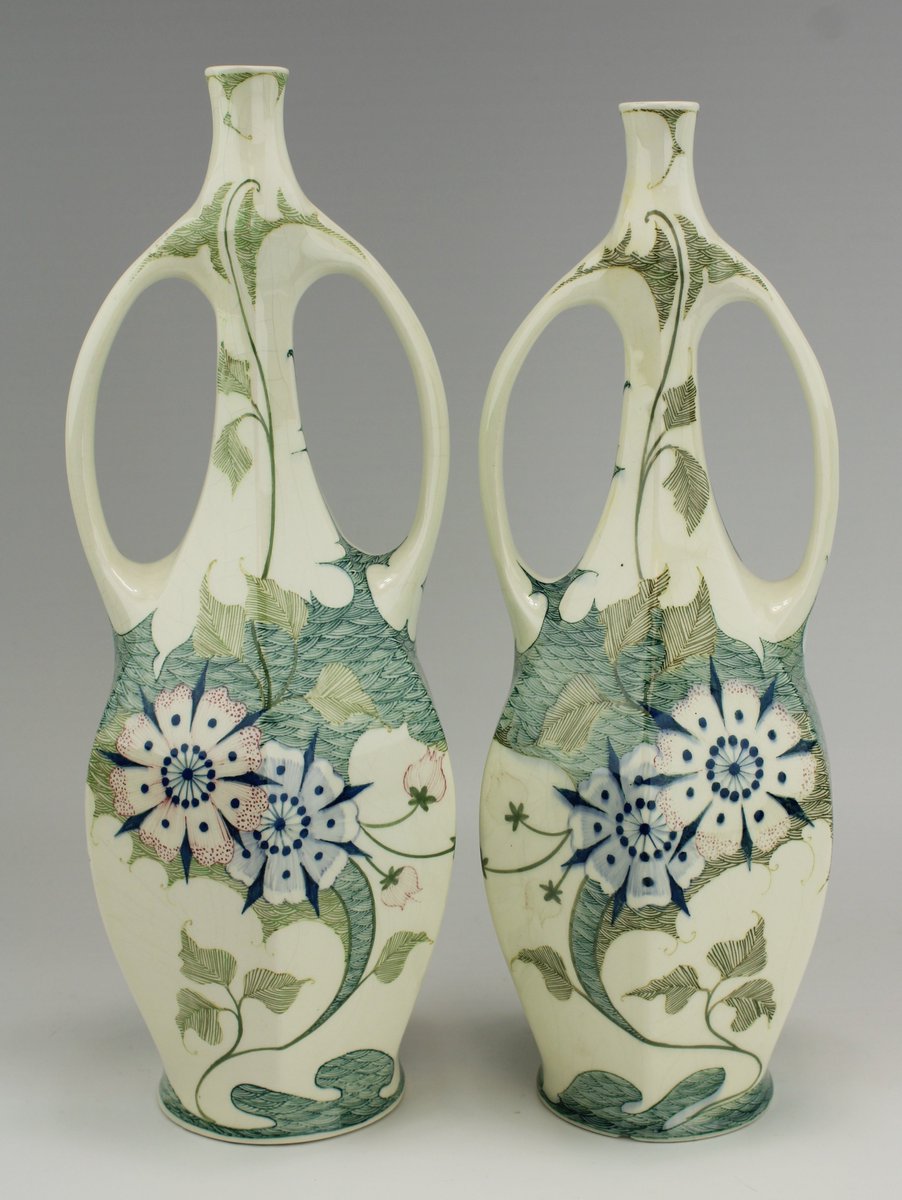 NouveauDeco's tweet photo. Two Art Nouveau vases from 1910 by "Plateelfabriek Zuid-Holland", Gouda, The Netherlands. https://t.co/1U14A6hQUf