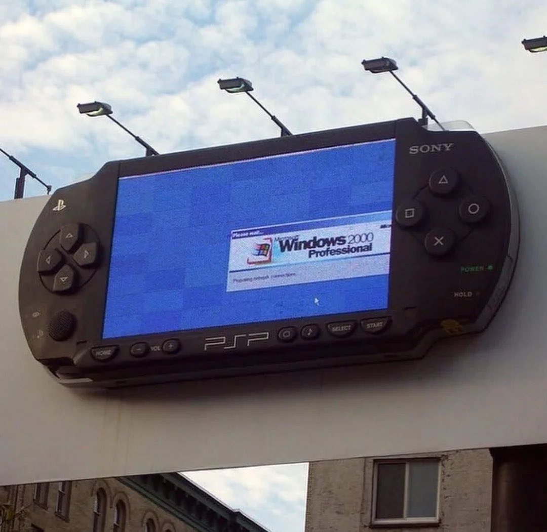 a PSP billboard booting Windows 2000 (2005)