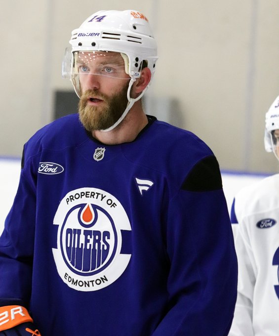 Mattias Ekholm on the ice at the Downtown Community Arena in a blue Oilers practice jersey
