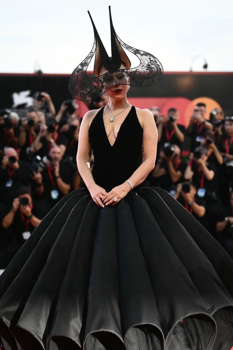 Lady Gaga at the Venice Film Festival, wearing an elegant black Christian  Dior Haute Couture dress, beret and sunglasses offsetting her blonde hair.  September 4, 2024  #LadyGaga