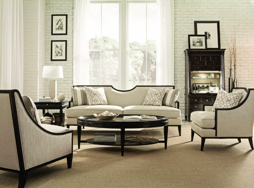 Transform your condo's living room with this this elegantly designed sofa and chair set in a warm, neutral color scheme. Combining contemporary and classic design elements, this collection features square tapered wood legs, an exposed wood frame, gracefully curved arms, and a...