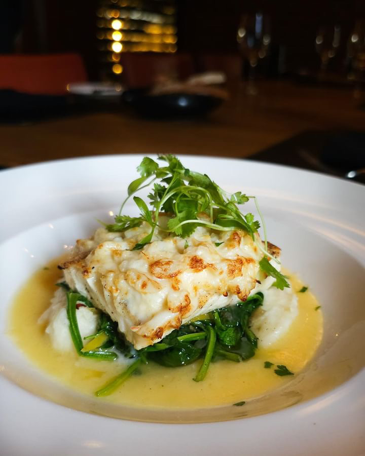 Indulge in our weekend specials. Start with our mouthwatering Shrimp Scampi appetizer, then savor the delicious Halibut topped with crab imperial.