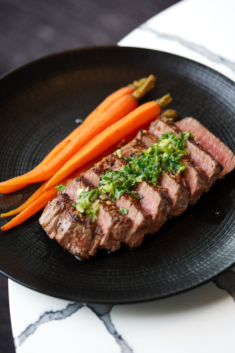Although chef @sooie_chief is a master of seafood, he makes a mean steak too! 🥩✨ This grass-fed Petite NY Strip comes with ramp chimichurri and honey-harissa baby carrots, on the dinner menu!