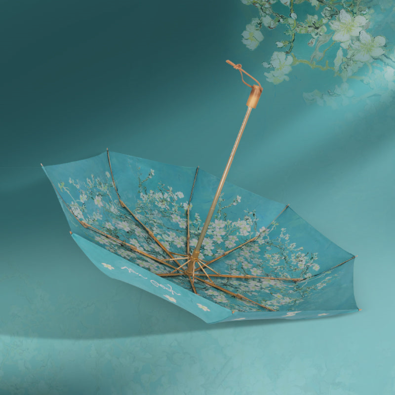 remulia97571's tweet photo. ゴッホの『花咲くアーモンドの木の枝』を描いた折りたたみ傘。

爽やかな青空を背景に、優美なアーモンドの花が咲き誇る様子を捉えています。

生地は二層構造となっておりUVカット率は99％以上です。

晴れの日も雨の日もお使い頂けます。