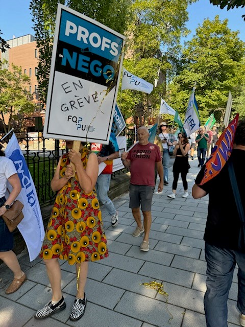 WLUFA's tweet image. For the 3rd time, WLUFA’s @CautFund Rep Cameron McKenzie joins the flying picket with @AMPL_AMPD. Support from across Canada grows! Faculty unions are essential to higher ED’s mission—and they’re under threat. #Solidarity #firstcontract #Solidarite @CAUT_ACPPU @OCUFA