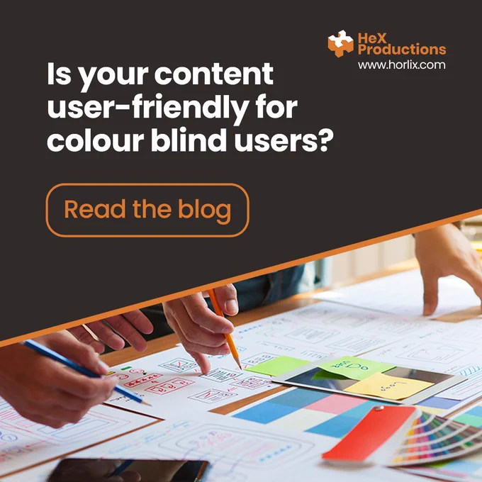 Two people are stood over a desk mapping out a new website. Sprawled across the desk are colour wheel charts. Above is the text "Is your content user-friendly for colour blind users?"