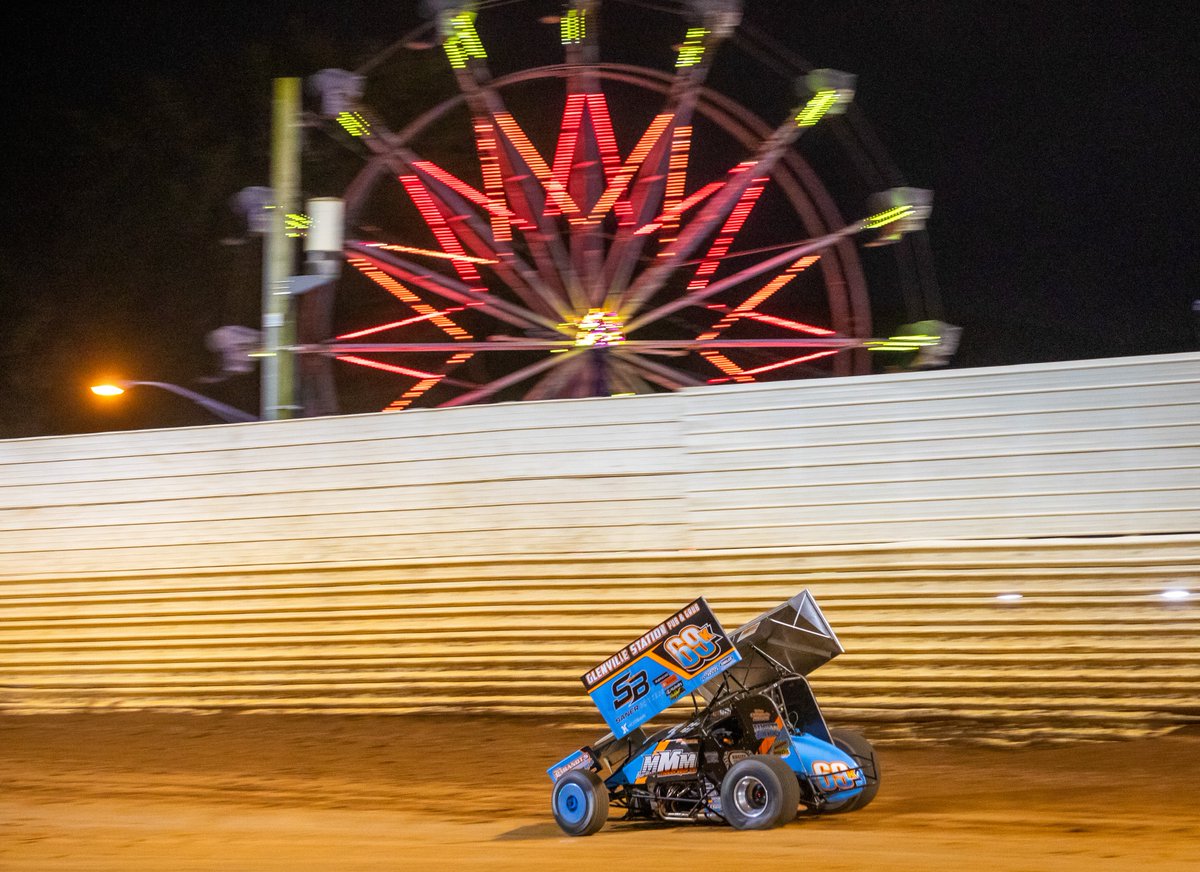 IRIphotography's tweet image. Logan Wagner races by the Juniata County Fair Ferris wheel during the 57th annual #Tuscarora50 @PortRoyalSpdway. Saturday's grand finale will pay $57,000!