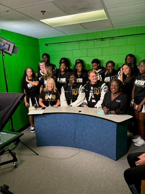 Our Senior players and cheerleaders welcoming in the students to Freeman's Mill ES! Thank you to Principal Pacholke for having us out this morning!