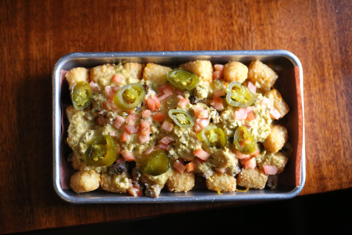 Might be time for some pub tots 

• Beef fat tater tots
• jalapeno popper cheese sauce
• homemade sausage
• pickled jalapenos