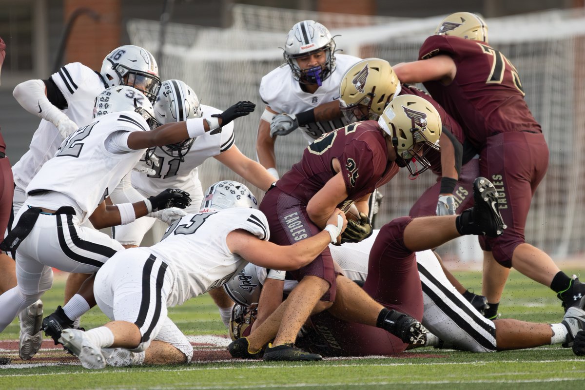 No.15/53 tackles the ball carrier in the backfield.