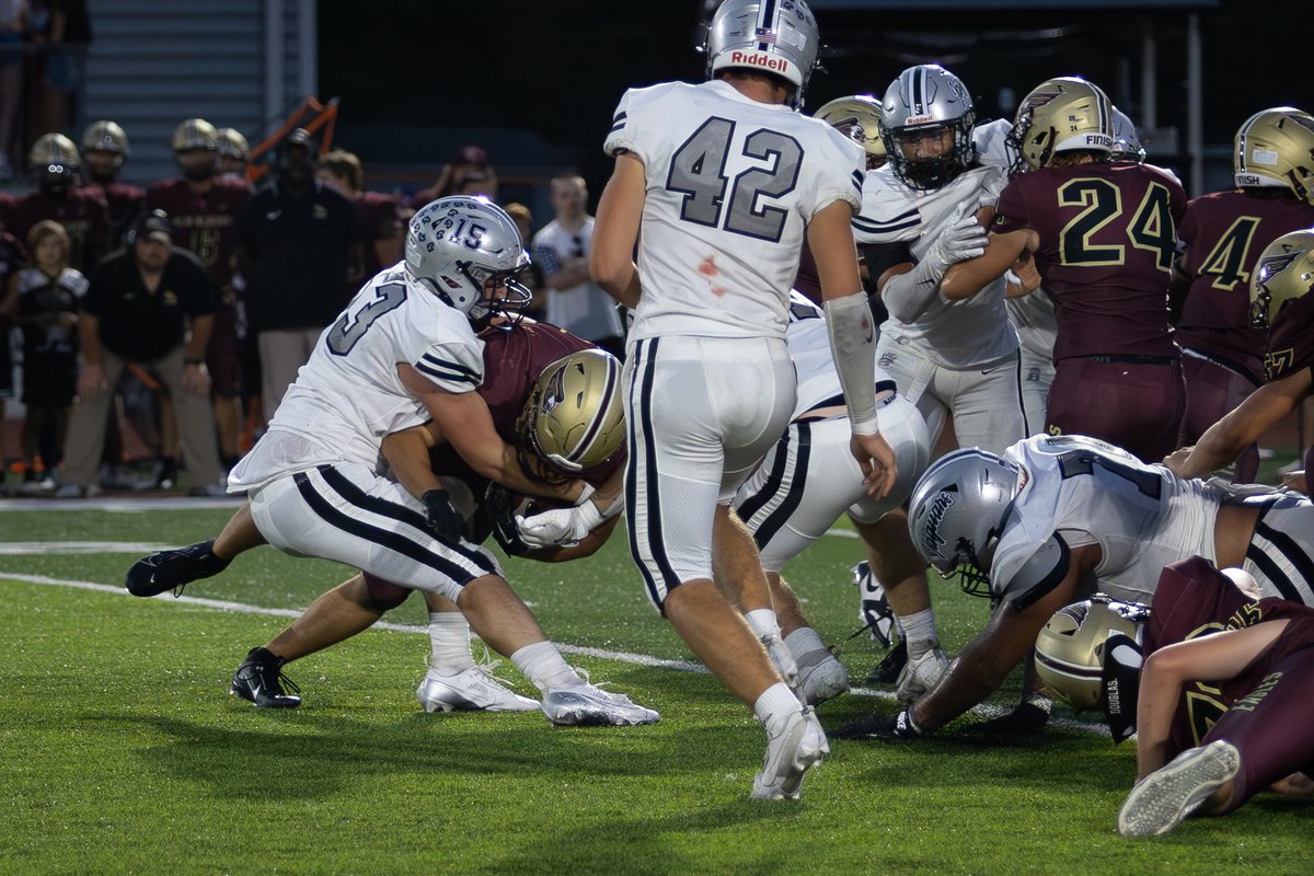 No.15/53 DB tackles the RB for a loss.