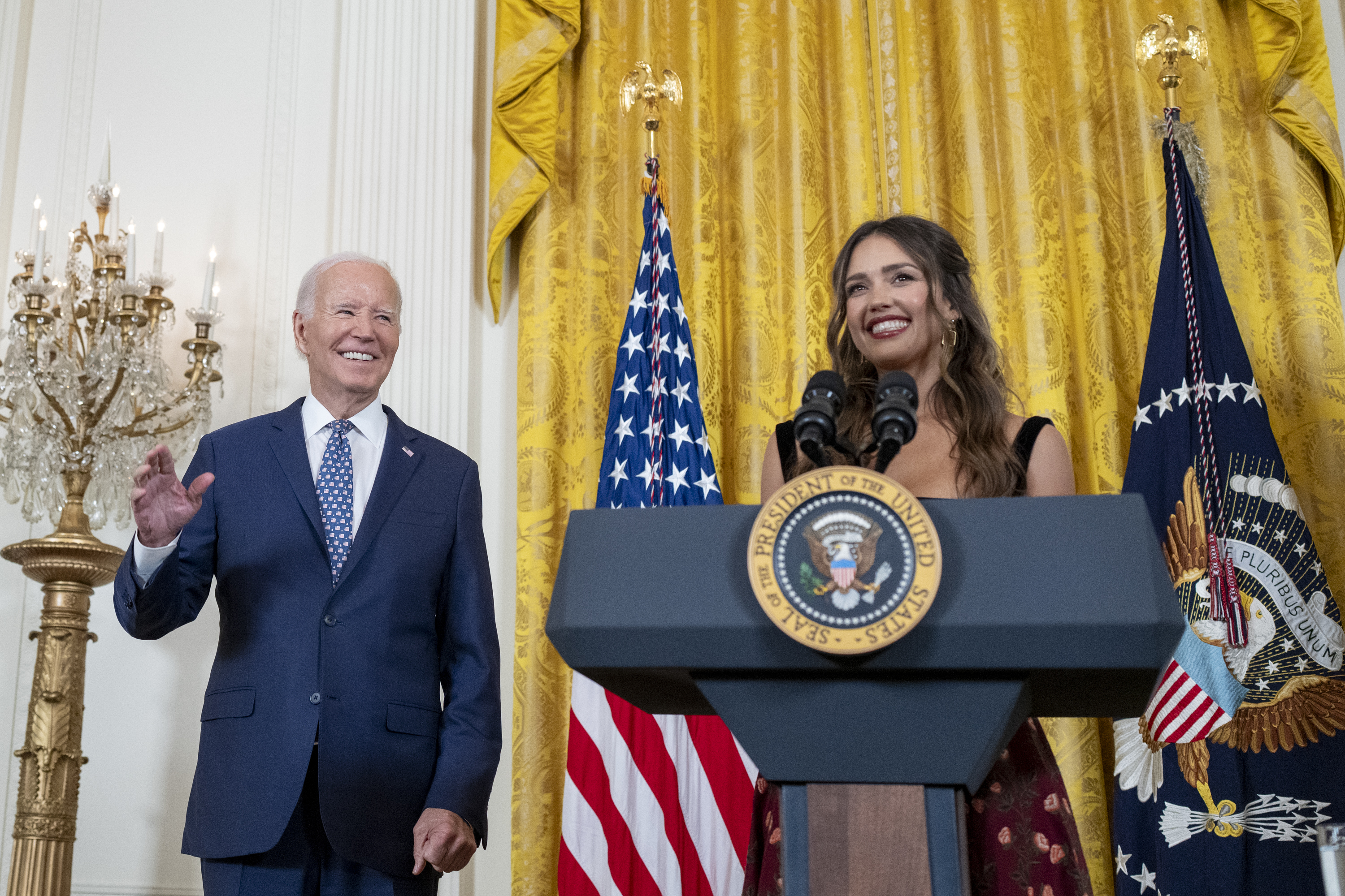President Biden watches as Jessica Alba remarks at a Hispanic Heritage Month celebration in the East Room of the White House.