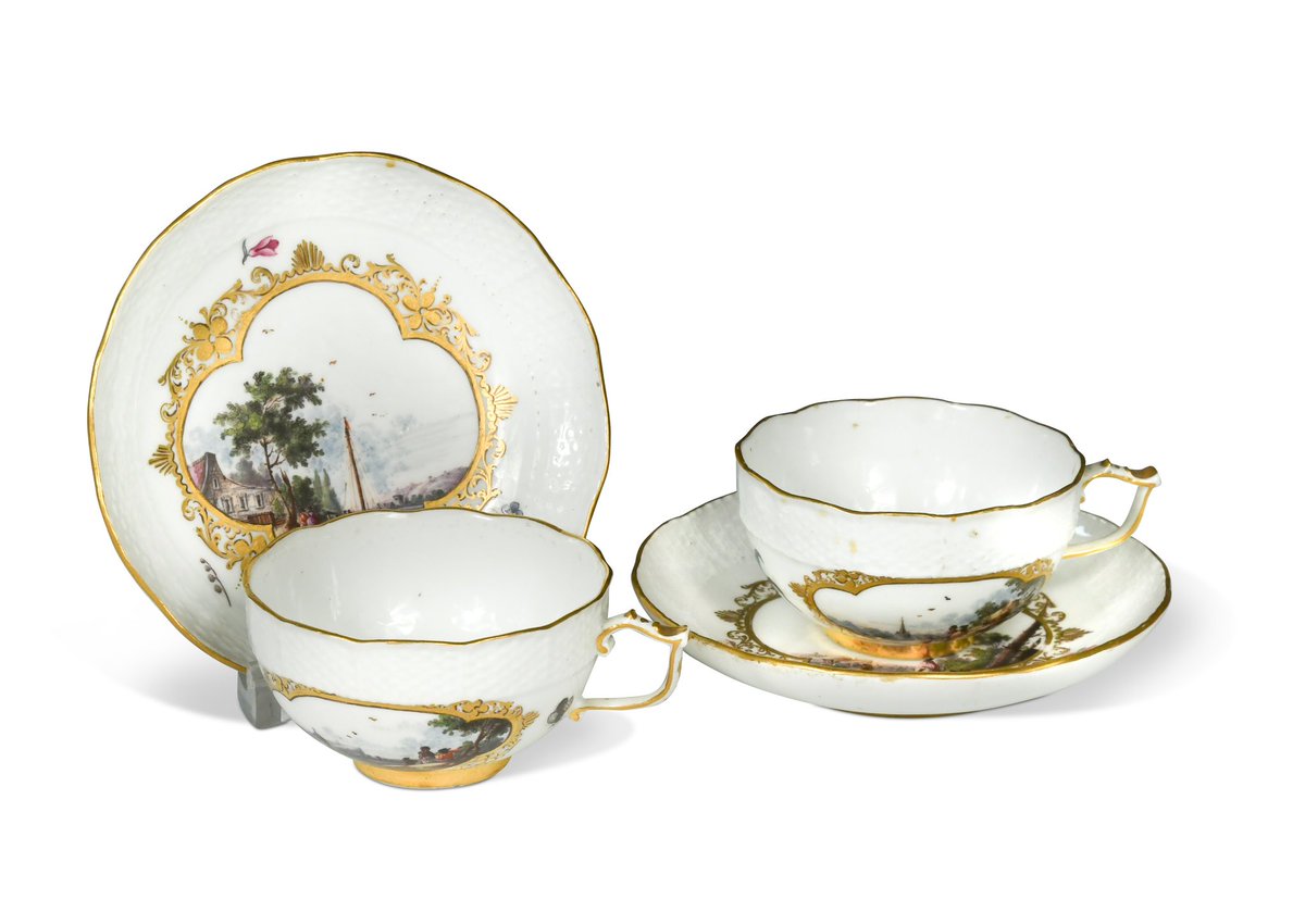 whitegoldsword's tweet photo. A good pair of #Meissen cups and saucers, circa 1740. The saucers are painted with harbour and landscape scenes within gilded borders and scattered flowers. Raised #Ozier decoration around the edges. Each cup has two cartouches, also with landscape and harbour scenes with #staffage. Early fish bone style handles. Each cup additional painted inside with similar scenes within red concentric circles based on Oriental examples. Meissen blue crossed swords to their bases and gilder’s symbol.