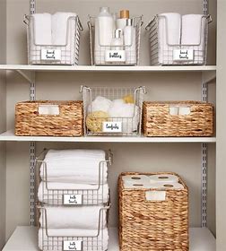 Roll towels and store them in a decorative basket or on an open shelf for easy access. Use a ladder shelf to hang and store towels vertically.

#BathroomOrganization #RolledTowels #DecorativeBasket #TowelDisplay #LadderShelf #VerticalTowelStorage #OrganizedBathroom #bathrooms
