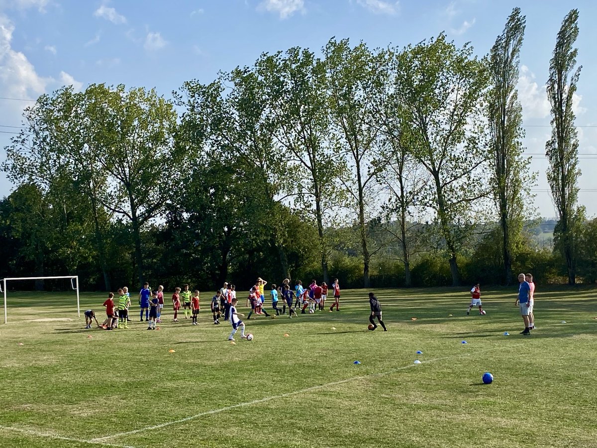 Clubs are back! Lots of footballers practising skills.