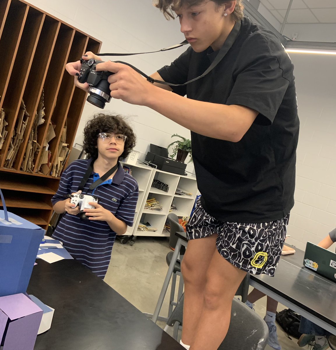 Photography is currently shooting a collection on Architectural Photography. To practice good composition, students built a mini cityscape out of paper. This will help with capturing good angles, and work different depths of field in a more manageable scale! <a href="/AHHSmules/">AHHS Mules</a> <a href="/AHISD/">Alamo Heights ISD</a>