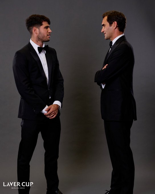 Carlos Alcaraz and Roger Federer poses on the black carpet at the Opening Night Gala of Laver Cup Berlin 2024.