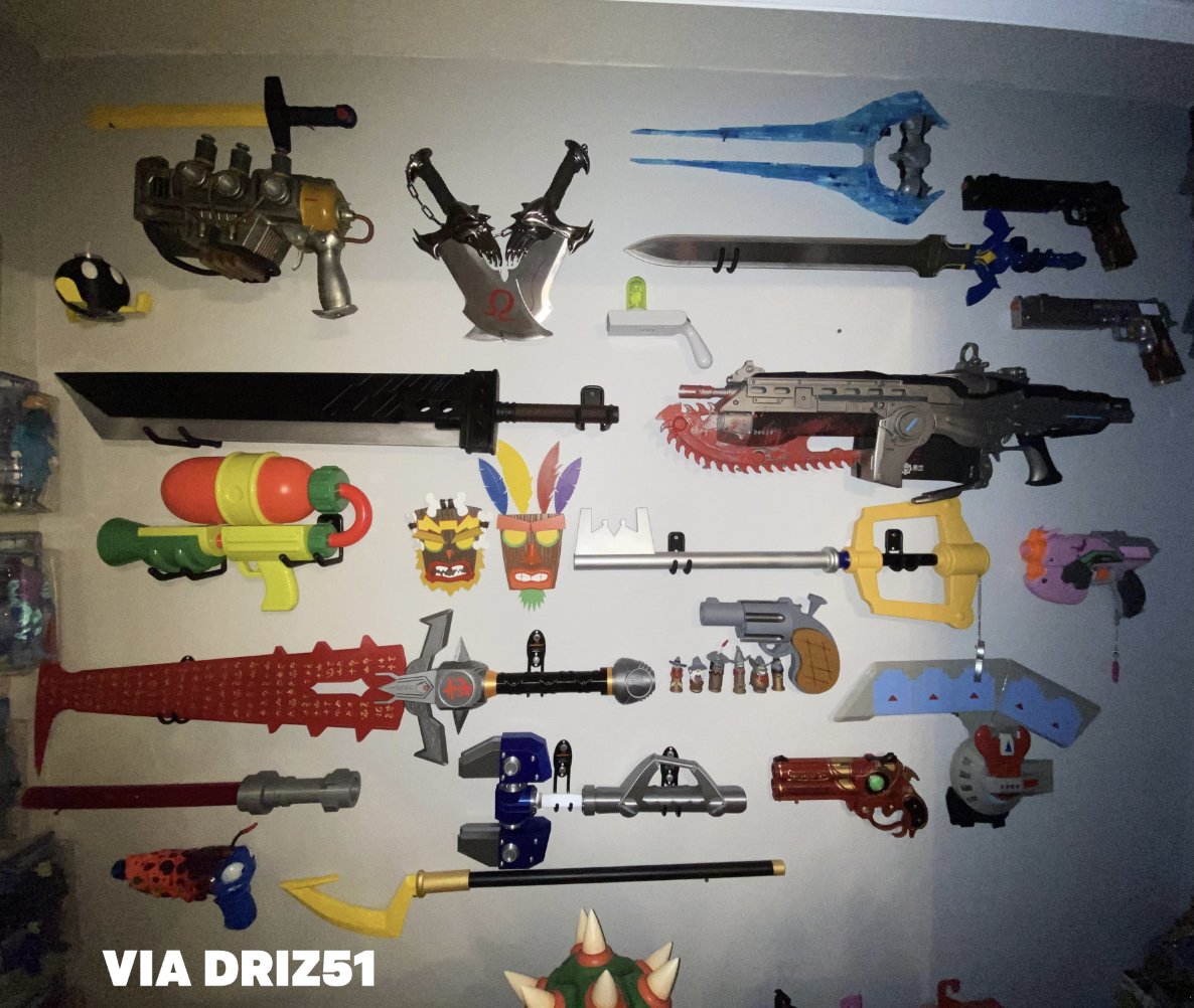 Dexerto's tweet image. Legendary video game weapon wall