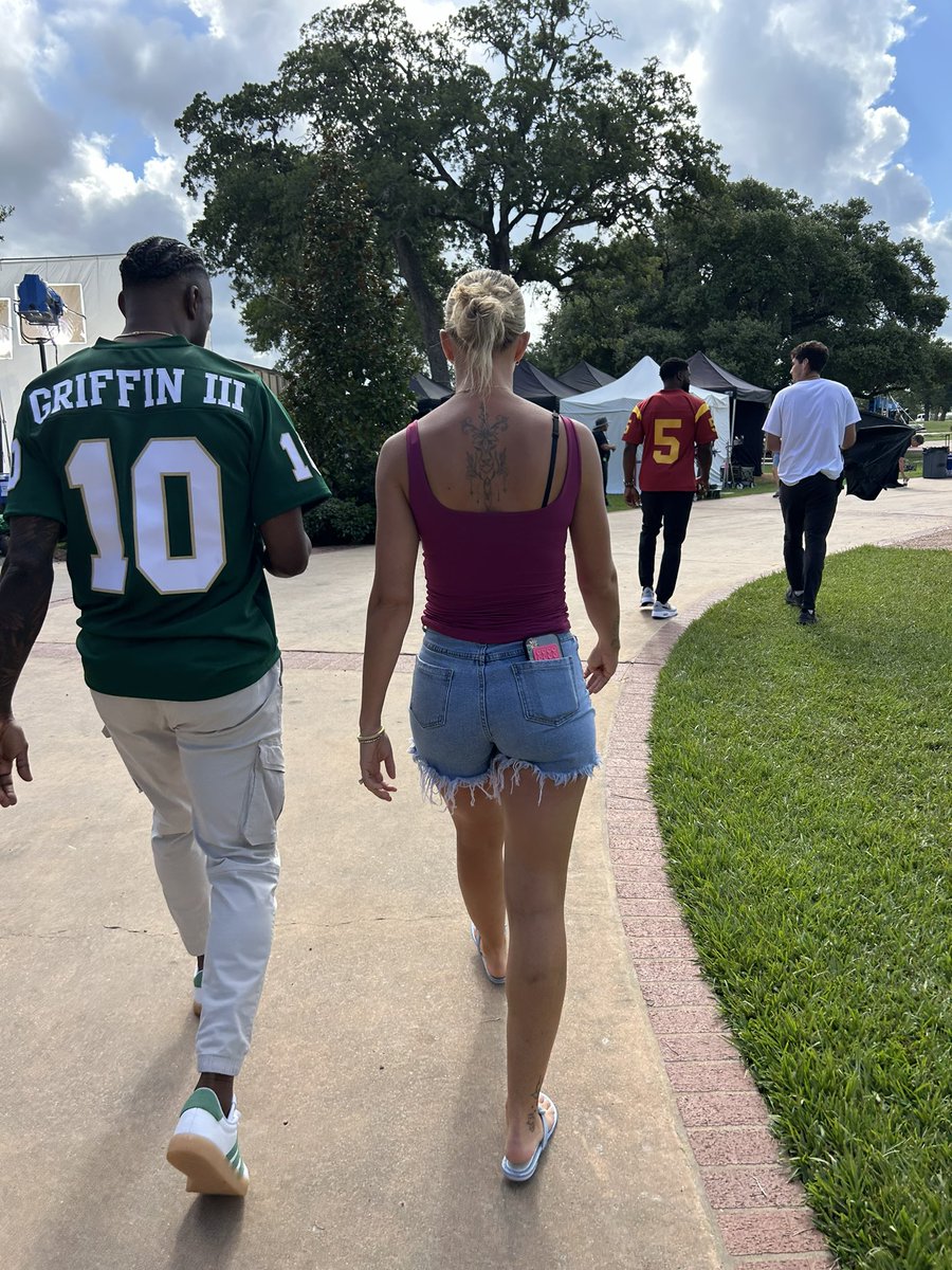 RGIII's tweet photo. Don’t let Reggie Bush being back in the Heisman House distract you from the fact that I wouldn’t be able to do what I do as a father, husband, analyst or businessman without this Estonian Queen you see stepping with me. She’s my best friend. Our 4 girls are lucky to call her Mom. I’m lucky to call her my wife, best friend, business partner, mother of our children and the best person I know. Thank you baby for making our house a home, teaching me that real love does exist and always having this family’s back. We love you.