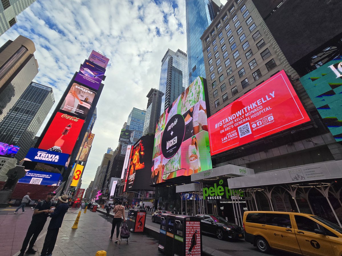 IStandWithKelly's tweet photo. Our New York Times Square billboard is LIVE today next to the iconic red steps! Our ad, featuring a QR code that links to the petition, will play all day in 30-second intervals on the 19th &amp; 33rd minute of every hour!

We have @alittledxnger on the ground to share pics throughout the day, and you can see it for yourself on this livestream 🥰: https://t.co/MZwBHTFhTS

NYC is a huge tourist destination where ABC also has studios! We are hoping for more eyes on the petition with all of that foot traffic… and we will be sending GH &amp; ABC photos of the billboard too, showing how widespread our message is.

Next week, we’ll be back in LA 😉

#IStandWithKelly #KellyNYC

@WaltDisneyCo @RobertIger @ABC_Publicity