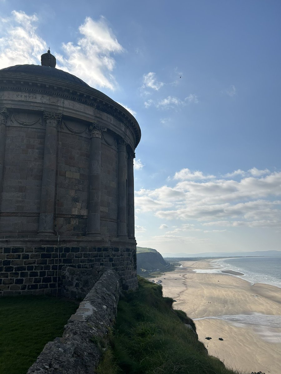 At one of my favourite places; the amazing Mussenden Temple at Downhill, on the north coast of Ireland. This was the library of Frederick Hervey, 4th Earl of Bristol and Bishop of Derry. I published a chapter about it in 2011. Weather not usually like today!