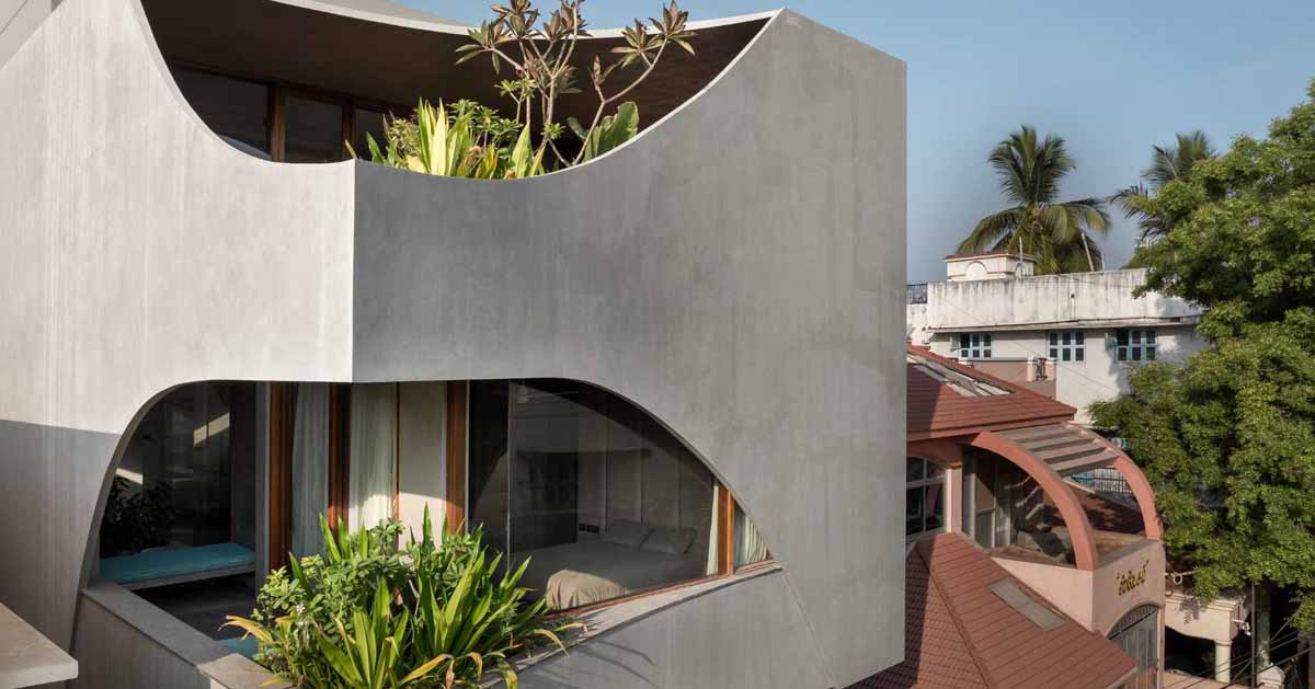 A Curvy Concrete Cube With Cut Outs For Windows Is The Form Of This New Home dlvr.it/TDV15Y