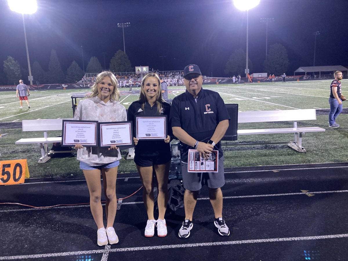 Creston all-state softball players Ava Adamson and Jersey Foote were honored at halftime with coach Dave Hartman.