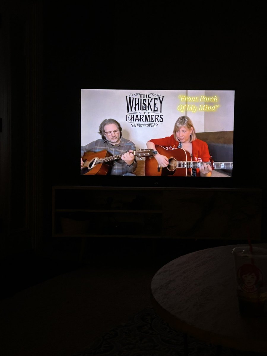 sitting on a rocking chair and listening to the whiskey charmers . this is the best
