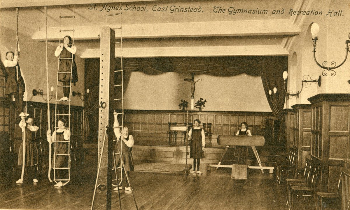 It's #GymDay today, celebrating all things related to gyms and working out. Clearly, many people's first experiences of a gym are the ones at a school - like this one from the prospectus for St Agnes School.
Hats off to the girl on the left who is halfway up a rope!