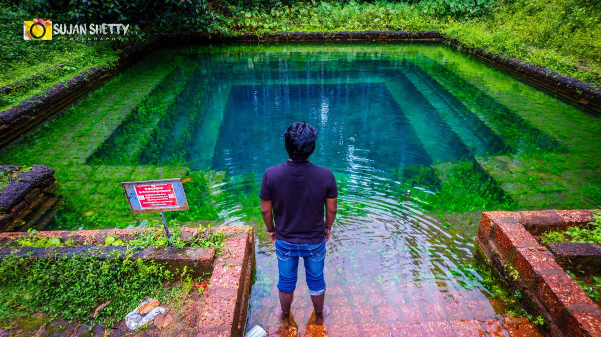 The most crystal-clear temple pond I’ve ever seen! 
Nellithirtha Pond 💚
📍Shree Somanatheswara Cave Temple 🙏
Kuppepadav, Nellitheertha, Mangalore.
#nellitheertha #cavetemple #lordshiva #pond #lake #dronephotography #nature #beautifulpond #mangalore #tulunad #kudla