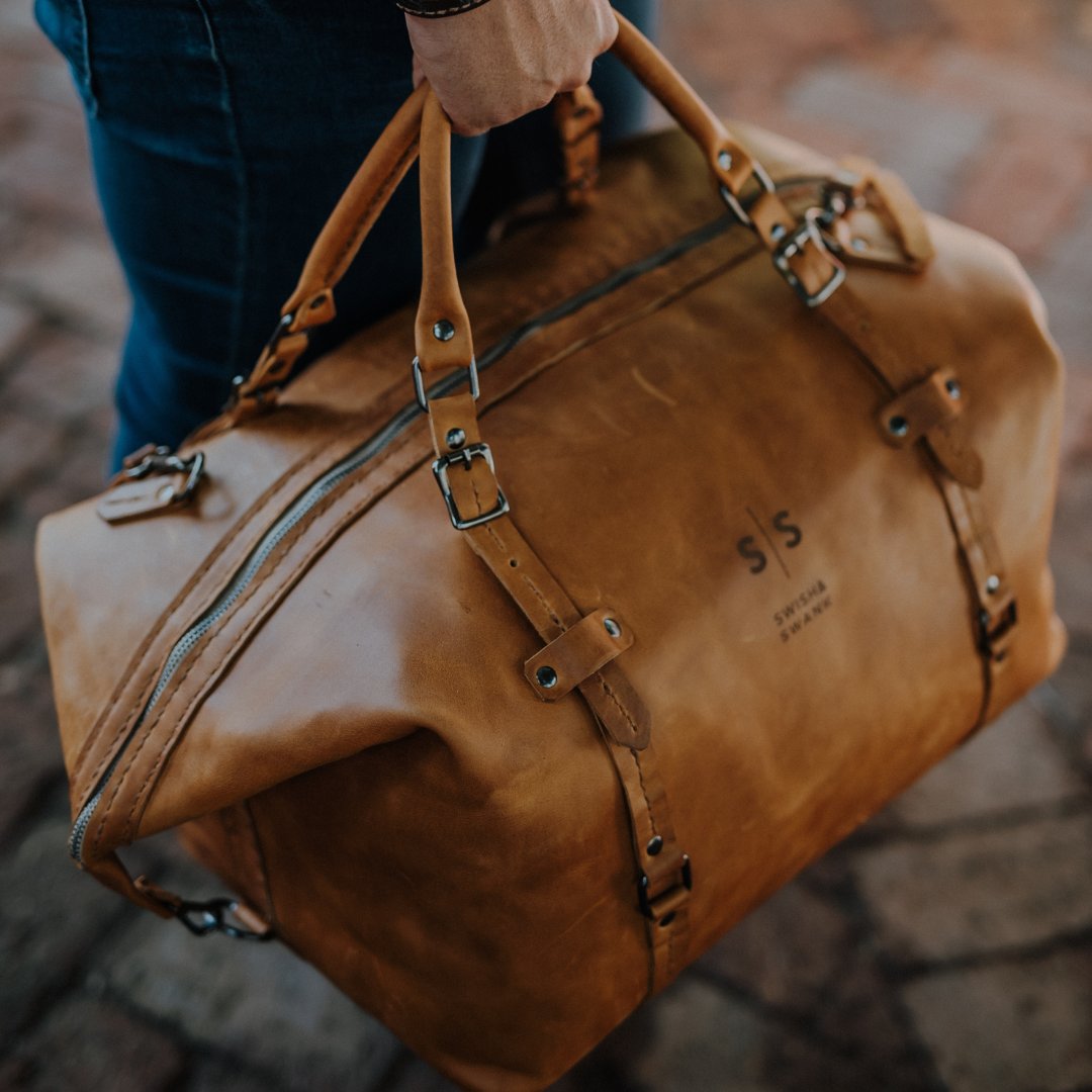 Feel like you need a getaway? This is your sign to do it!
Travel in style with our Genuine Leather Premium Duffle Bag.
This duffle fits perfectly in the airplane overhead compartment which makes it the perfect companion for a weekend getaway or and overnight business trip.