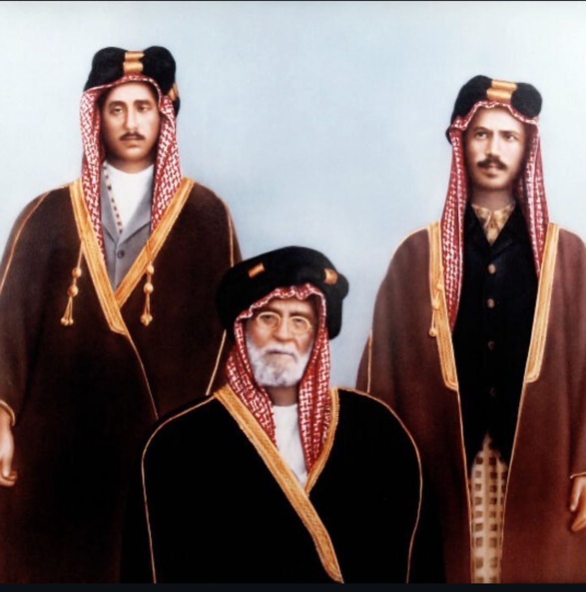 At the center sits Sheikh Ibrahim bin Abdul-Latif Al-Zuhair, the last Emir of Al-Zubair, accompanied by his sons. To his right is his son Abdul Majid, &amp; to his left is Khalil. 
The two fought against the British when they attacked Al-Zubair in 1914 during the Battle of Sayhan.