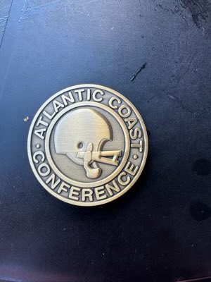 EWood70's tweet photo. A buddy’s son got this coin after the coin toss at the Louisville Football game Saturday from the head referee. Not sure I agree with the tails image.. 😳 https://t.co/ob1IZ3KZTW
