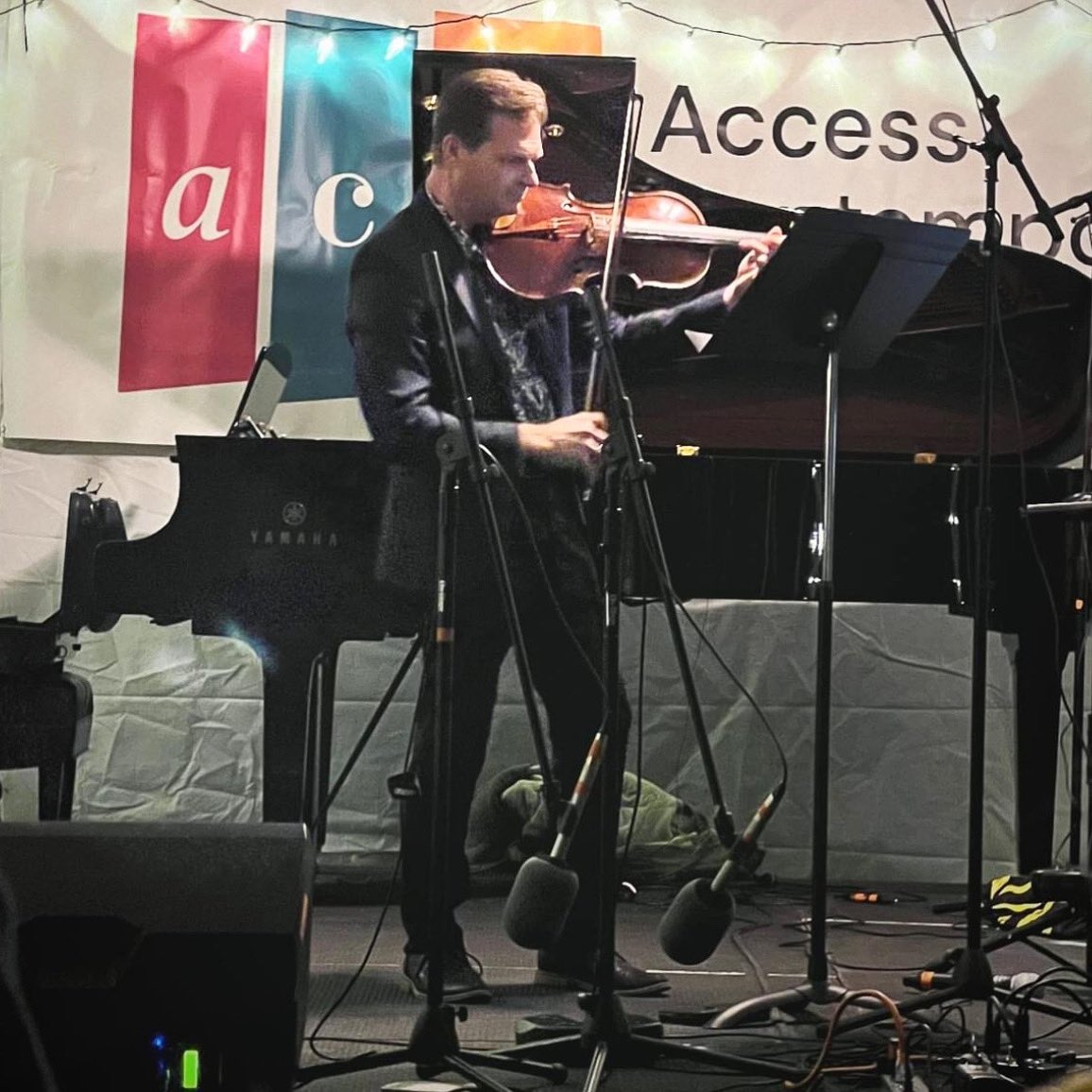 When the composer snaps a photo on you in the act of giving the world premiere of a piece they wrote for you.

Thank you <a href="/EricMalmquist1/">Eric Malmquist</a>. I adore playing your Sonatina for Solo Viola.

From the Thirsty Ears Festival in Chicago this weekend. 

#newmusic #composer #chicago