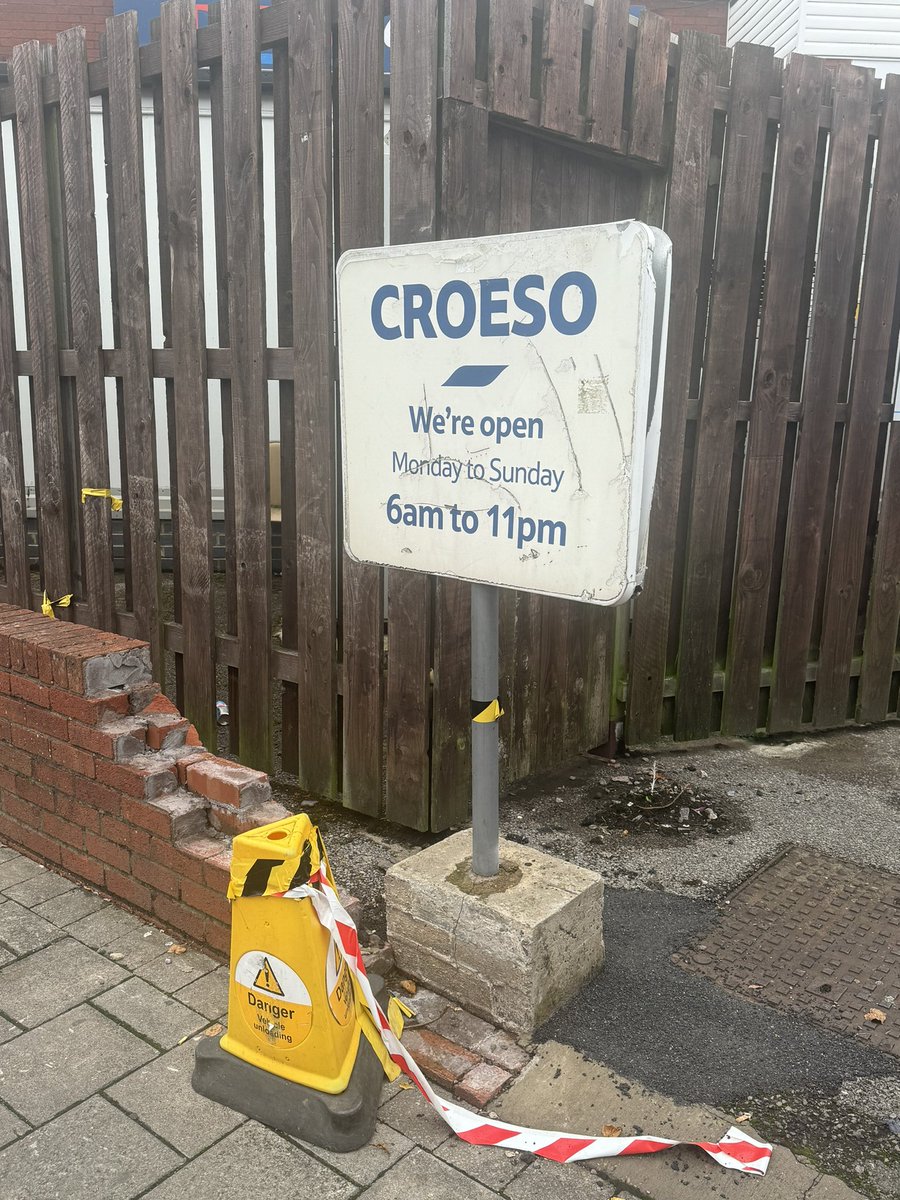 Wizzer10's tweet photo. @Tesco thank you for putting up sign knocked over by Tesco lorry but is this all Grangetown Cardiff deserves. Please can we have a new one and please fix the wall. https://t.co/LT87JyZaiH