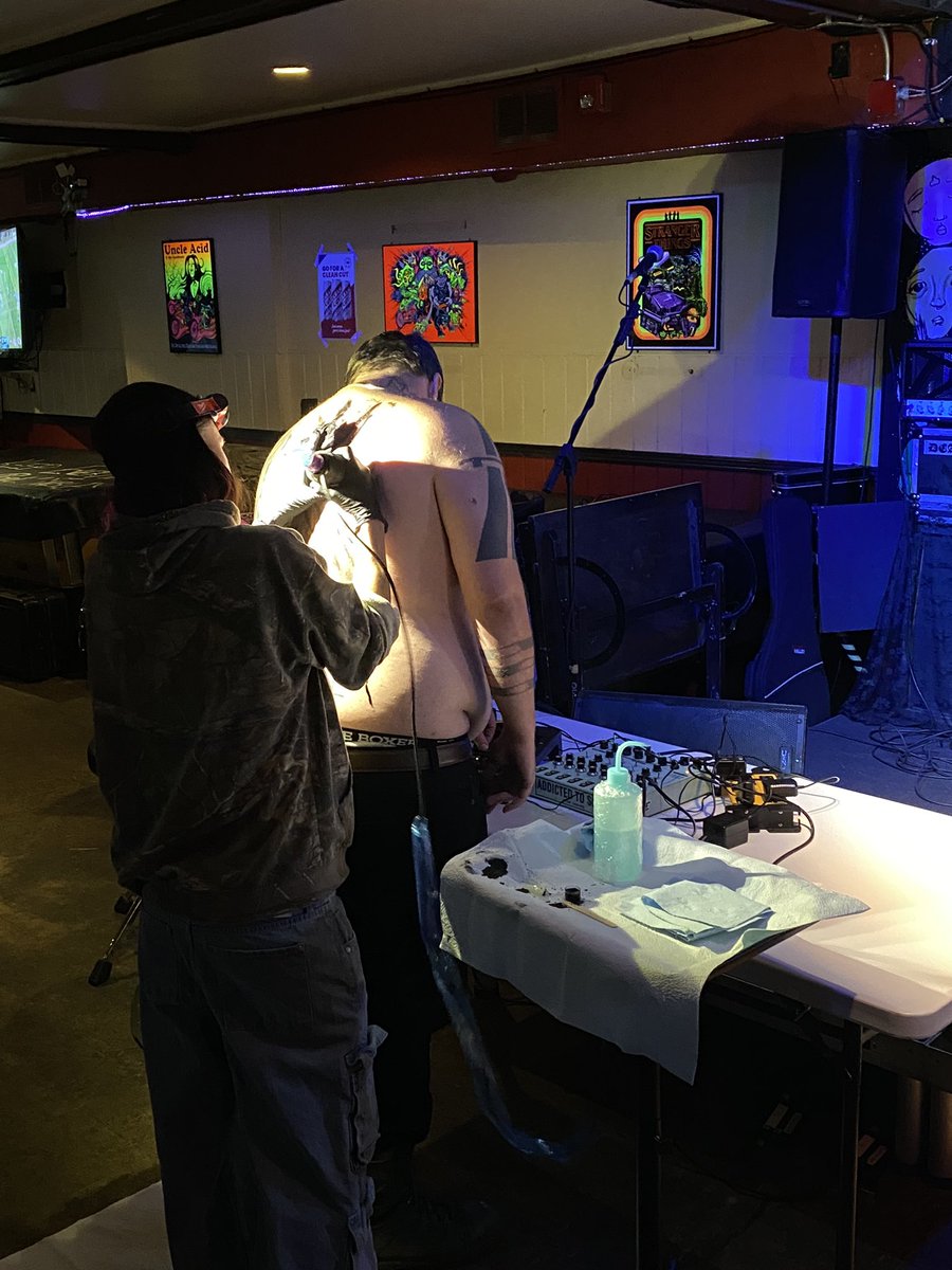 No fucking way is the opening noise act getting tattooed mid-set